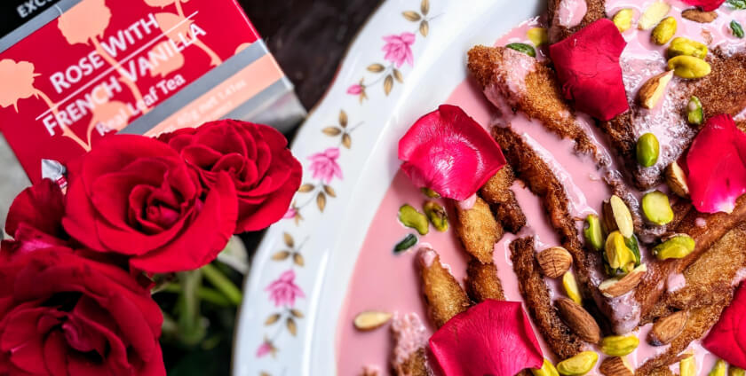 Dilmah Rose French Vanilla Tea Infused Shahi Tukra next to Dilmah Rose French Vanilla Tea box and some roses