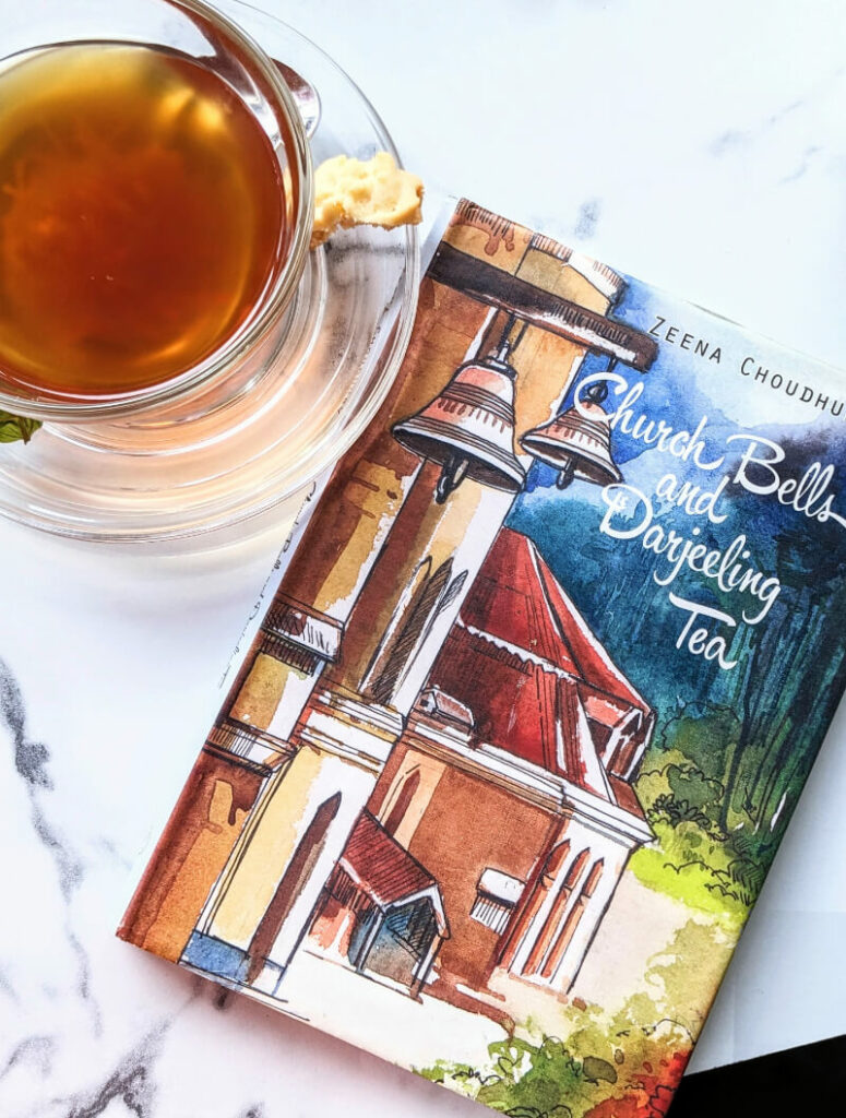 a cup of cold remedy herbal tea next to a book