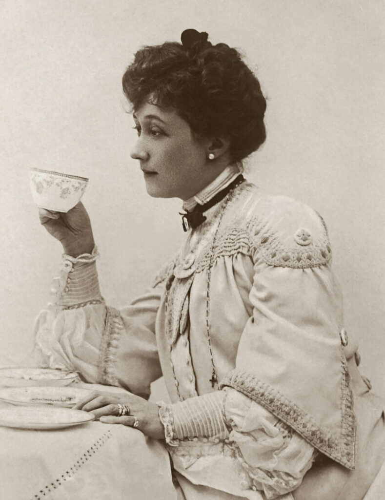European woman drinking tea; tea historically became popular in Europe in the 1700s.